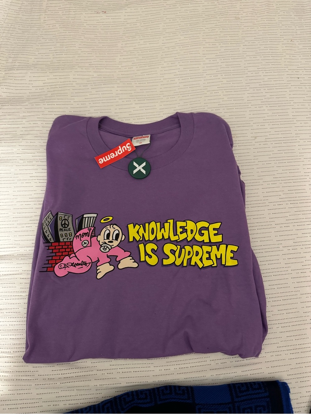 Supreme Purple Tee with Yellow 'Knowledge Is Supreme' Graphic